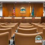 Photo of LCF City Council Chambers, audience chairs and dais.